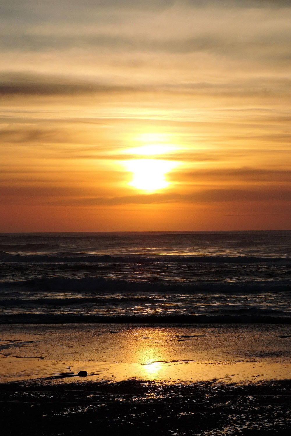sunset over the ocean at Nelscott Beach in Lincoln City Oregon