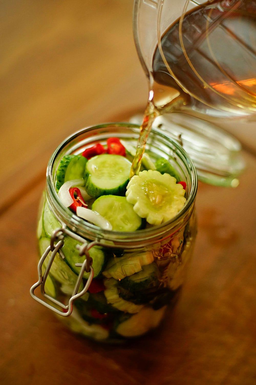pouring dressing on salad in jar