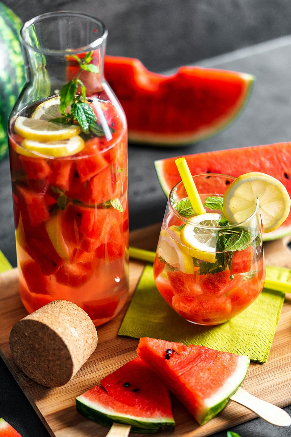 watermelon lemon mint infused water in a big glass bottle