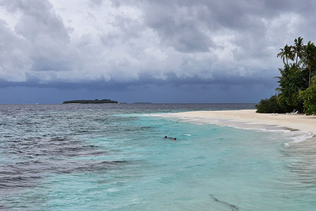 snorkelers in the Maldives while storm is approaching