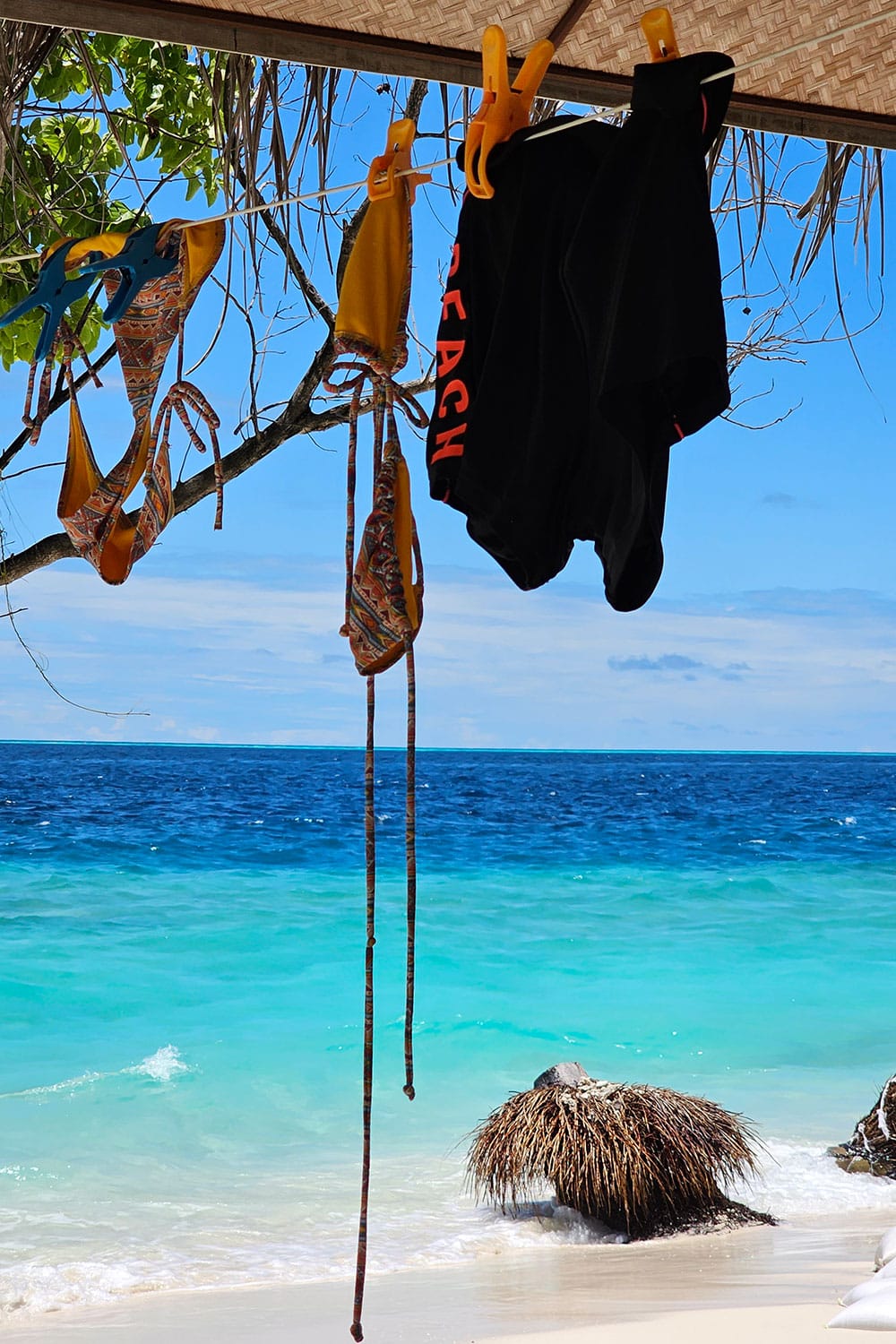 drying swimsuits hanging on a line in the maldives