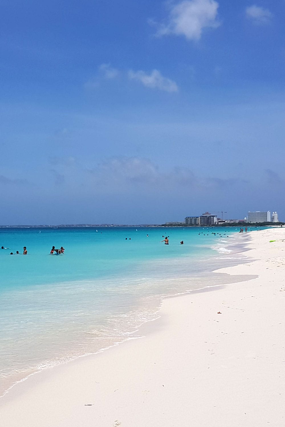people at Eagle Beach in Aruba on a sunny day
