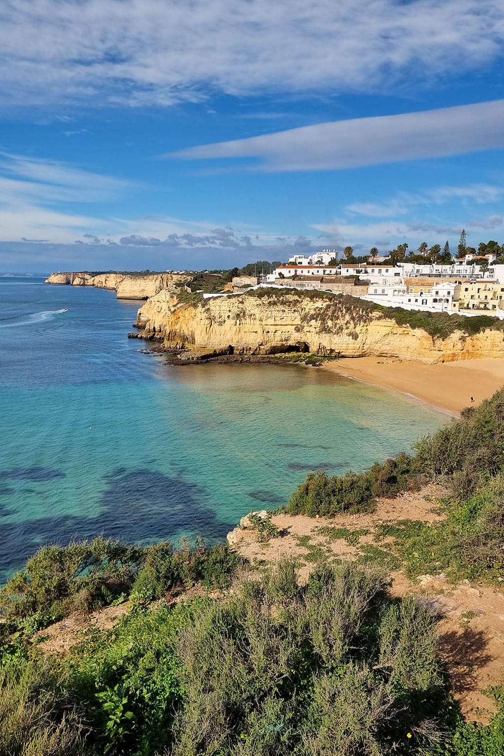 the empty Caroeiro beach in Portugal on a sunny winter day
