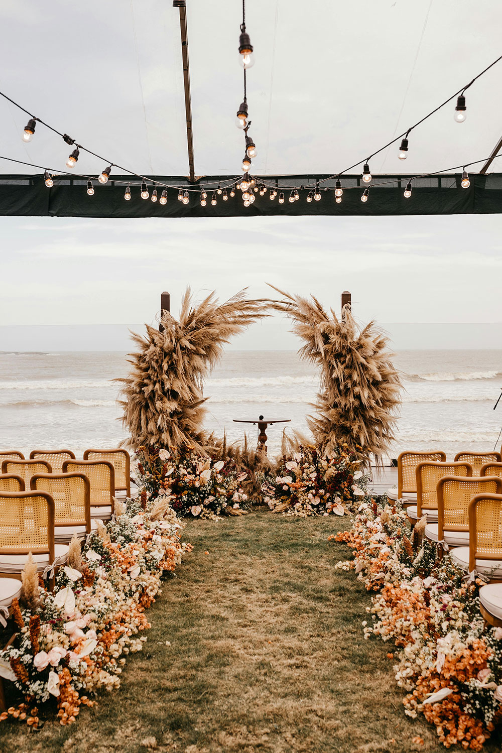 beach wedding venue decorated in warm neutral colors