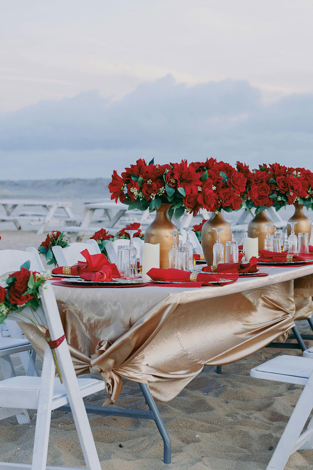 elegant table setting featuring gold and red colors