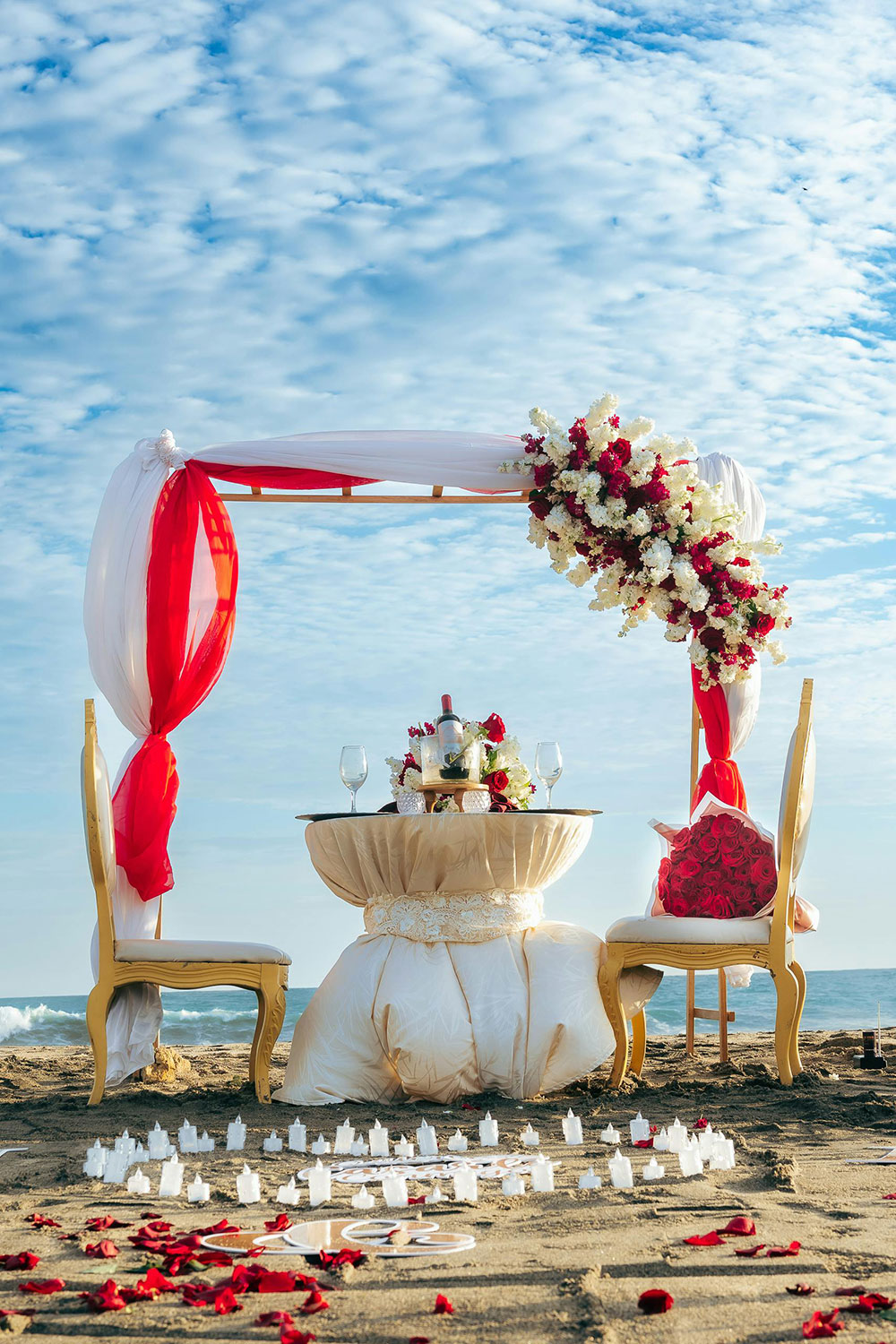 beach wedding arch and table decoration using red and white colors