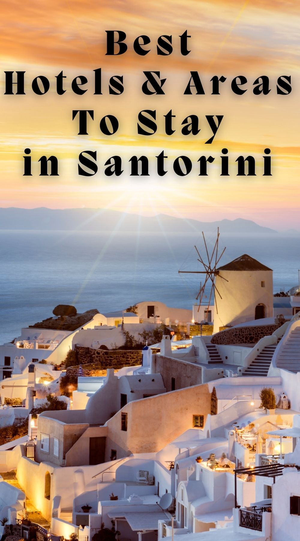 eveing view of Oia village, Santorini with golden light and illuminated houses