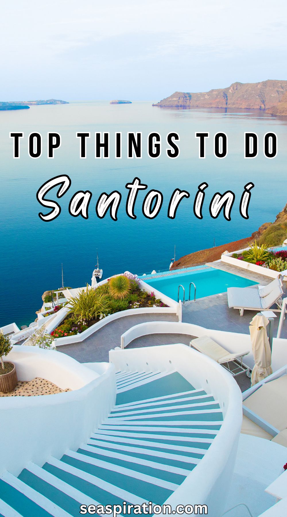 stairs leading to a pool overlooking the sea in a resort on Santorini island