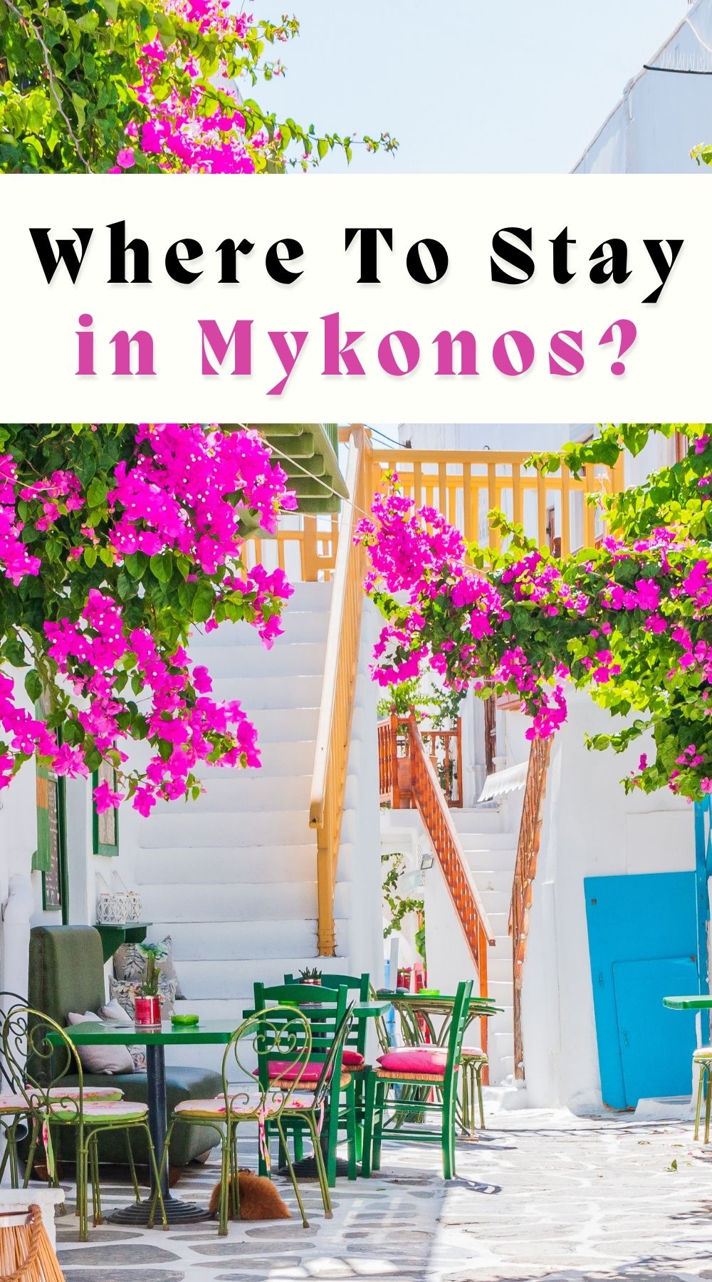 narrow street in Mykonos town with vibrant pink bougainvillea flowers and tables and chairs on the street