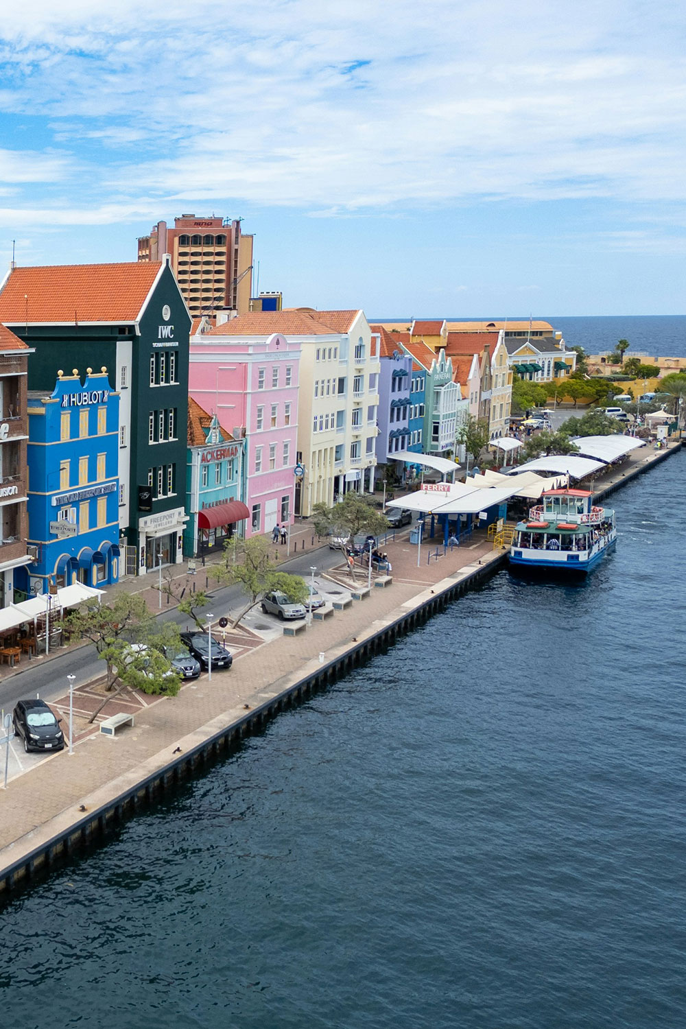 the vibrant waterfront of Willemstad with colorful buildings
