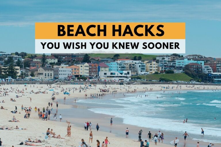 beach scene with many people who are sitting on the sand, walking on the shore or swimming in the sea