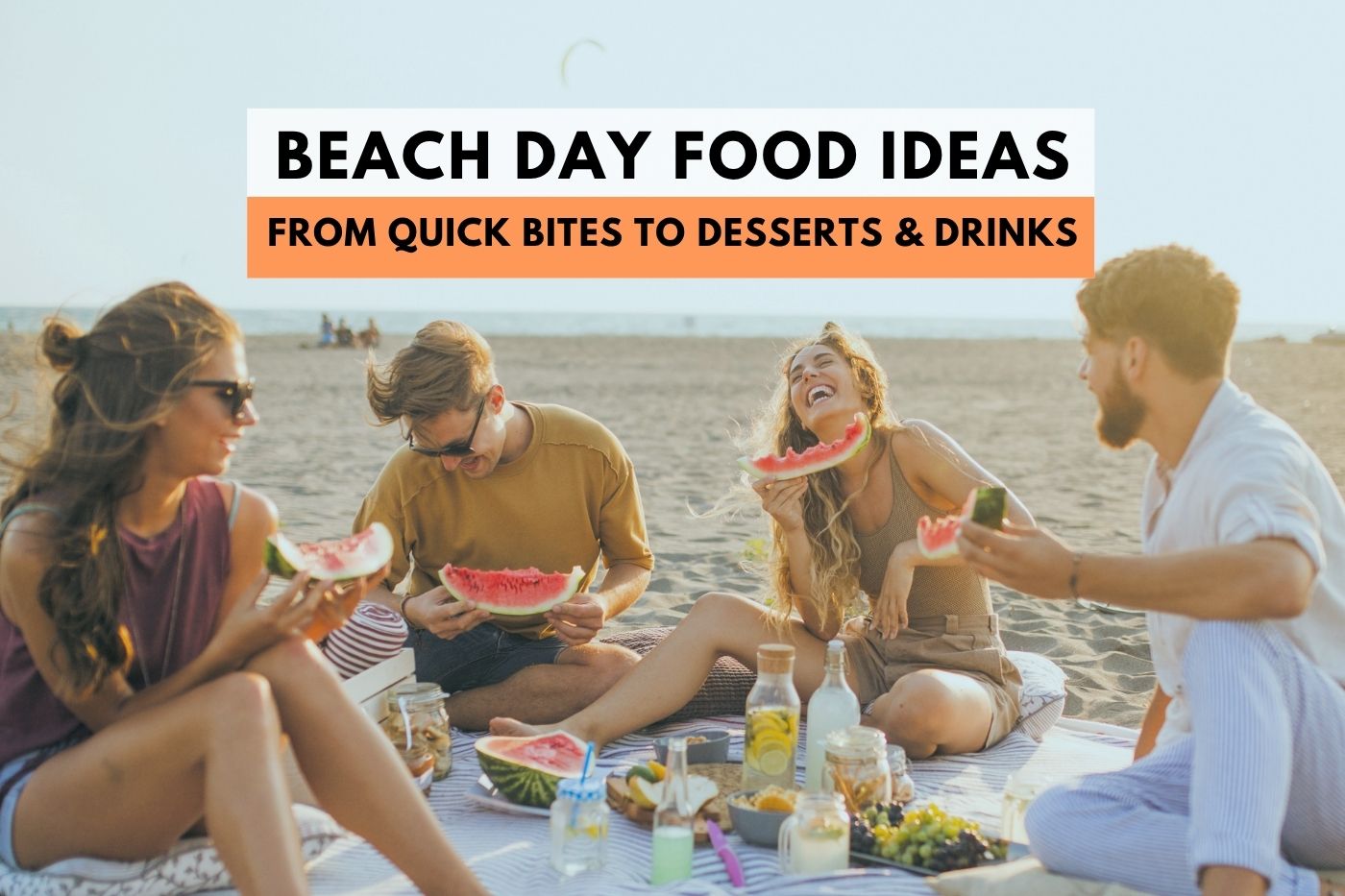 group of people eating happily at the beach